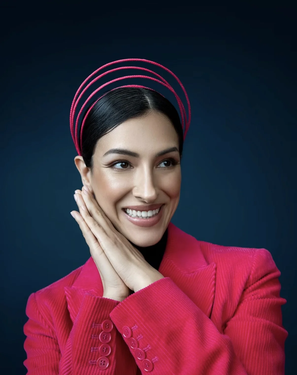 Beauty portrait with a sculptural pink headpiece