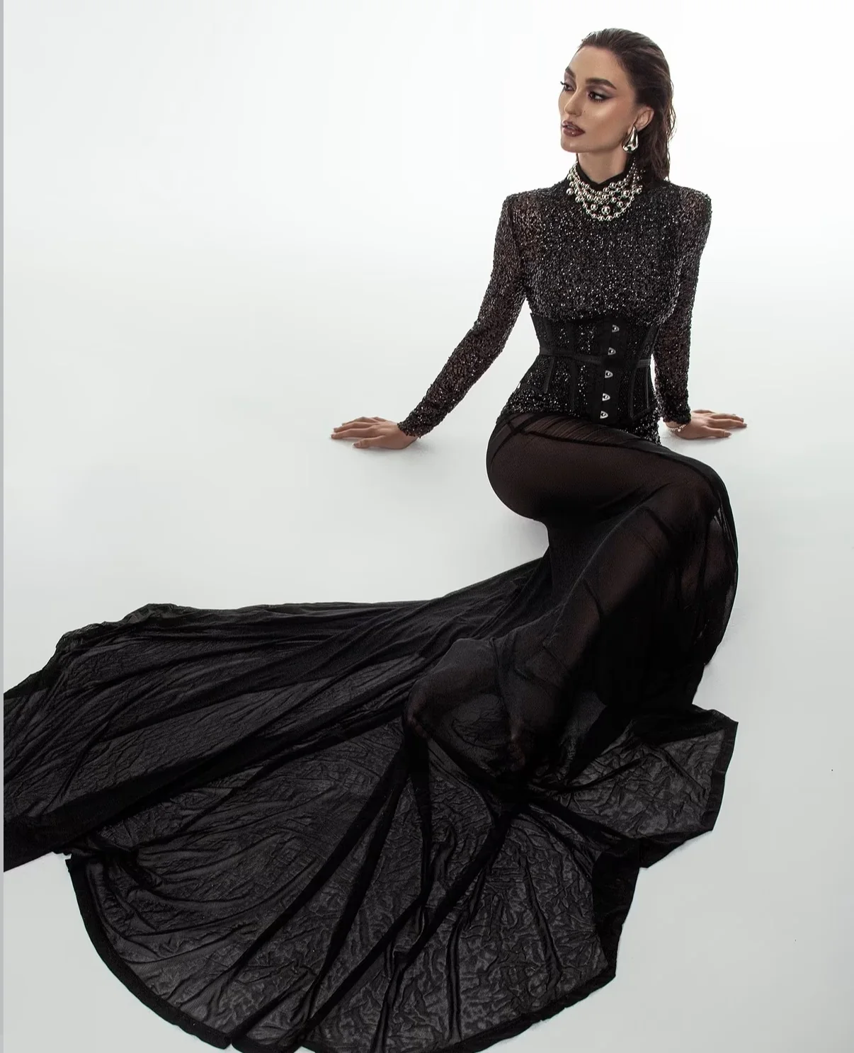 Black couture gown in a clean studio fashion editorial