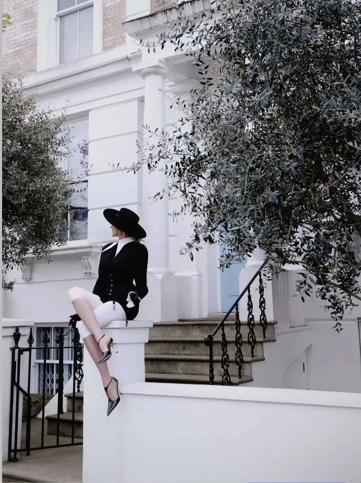 Black and white couture street-fashion portrait in London